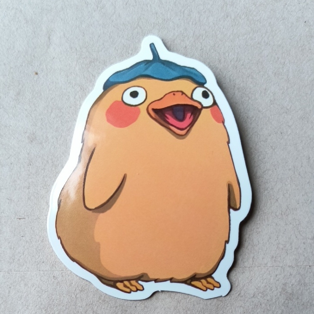Cheerful Orange Chick Sticker with Blue Acorn Hat Studio Ghibli
